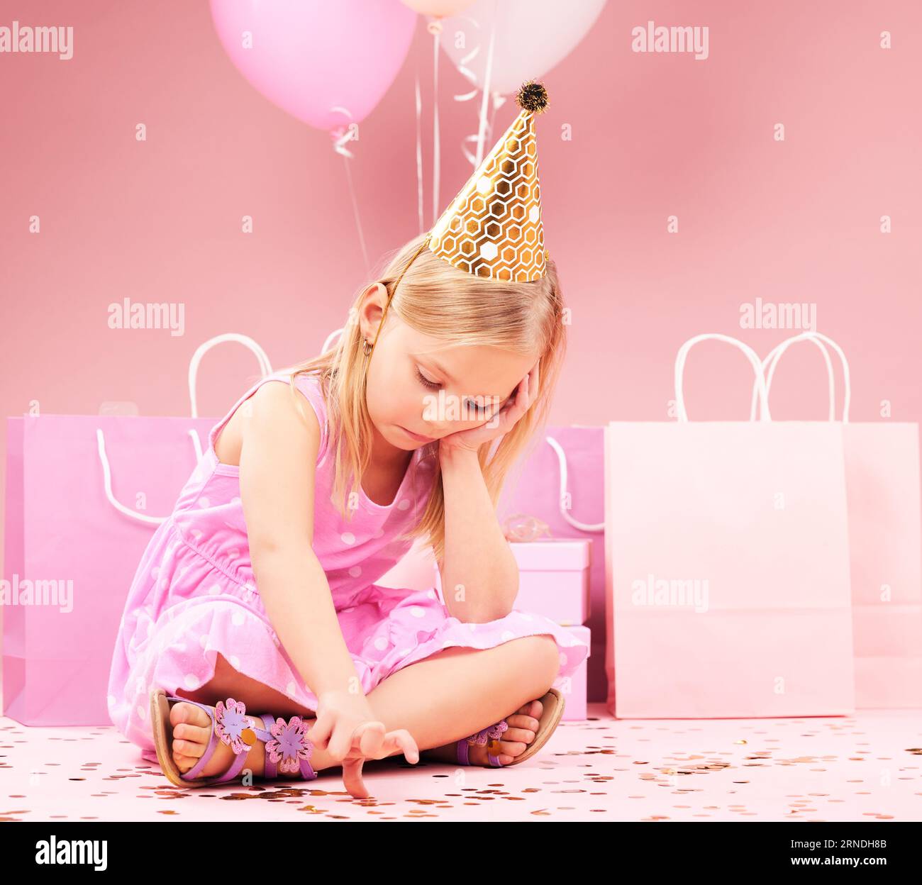 Depression, sad birthday and child on pink background disappointed ...