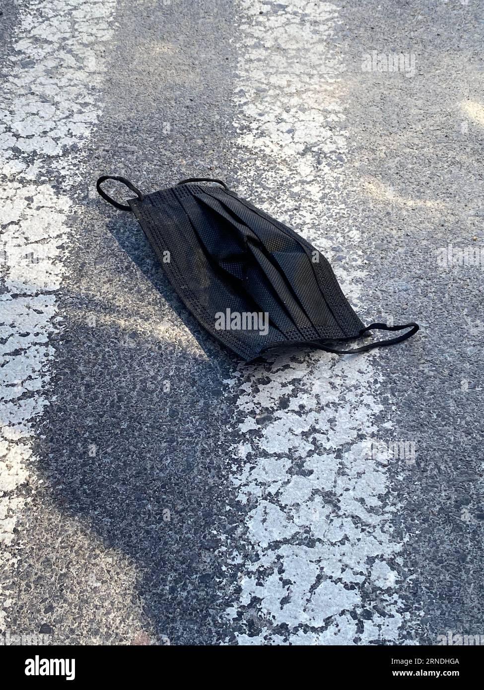 Face Mask Litter on a street Stock Photo Alamy