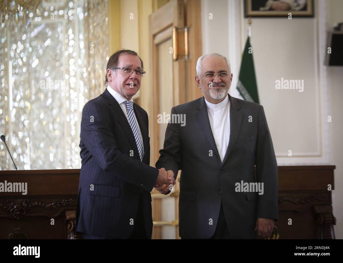 (160521) -- TEHRAN, May 21, 2016 -- Iranian Foreign Minister Mohammad-Javad Zarif (R) shakes hands with his New Zealand counterpart Murray McCully during a joint press conference in Tehran, Iran on May 21, 2016. Zarif said Saturday that the United States and the European countries should take practical steps to implement the nuclear deal dubbed as Joint Comprehensive Plan of Action (JCPOA). ) IRAN-TEHRAN-NEW ZEALAND-FM-PRESS CONFERENCE AhmadxHalabisaz PUBLICATIONxNOTxINxCHN   160521 TEHRAN May 21 2016 Iranian Foreign Ministers Mohammad Javad Zarif r Shakes Hands With His New Zealand Part Murra Stock Photo