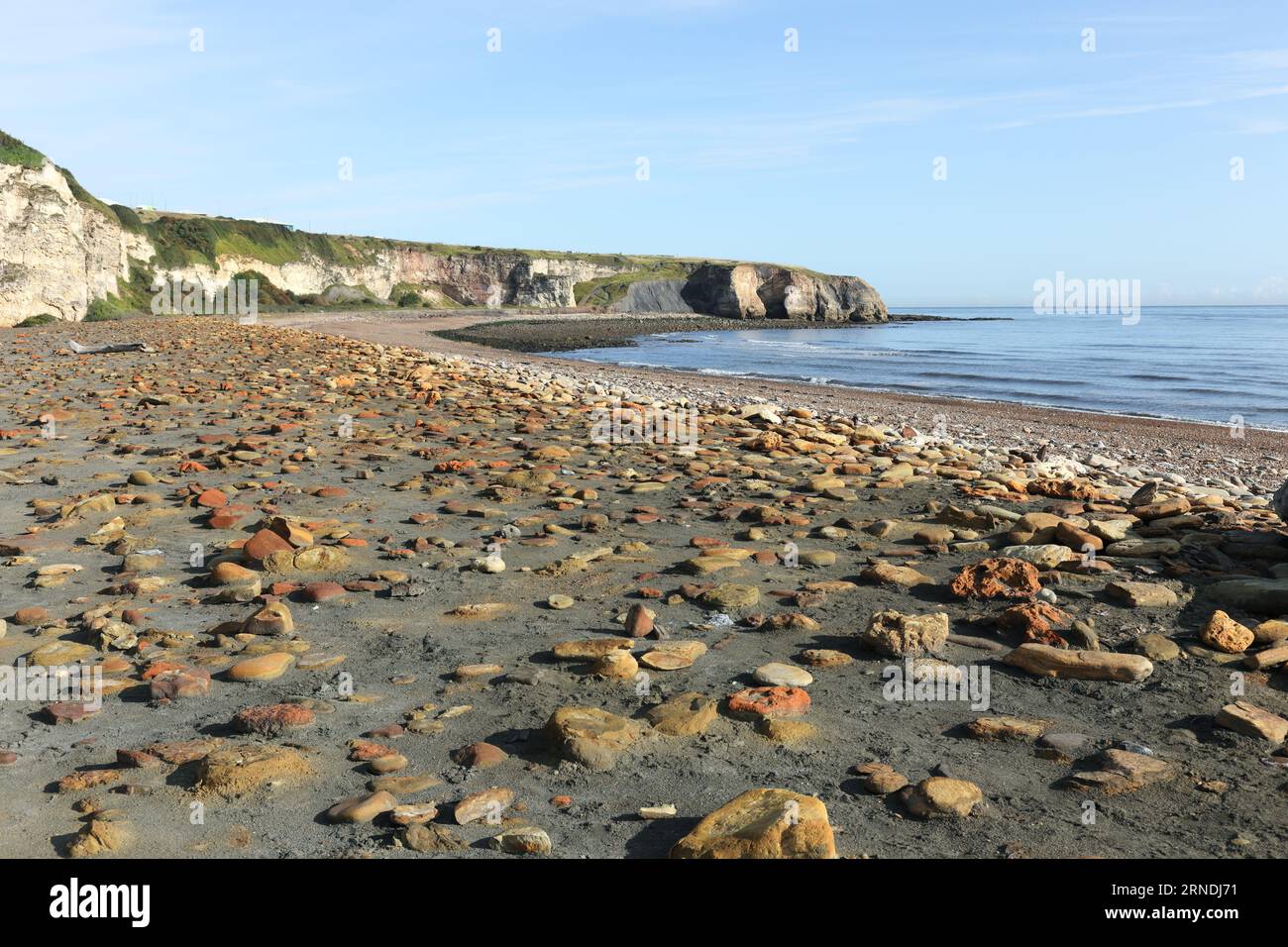Colourful rocks on the Blast Beach with the view towards Noses Point, Durham Heritage Coast, Seaham, County Durham, UK Stock Photo
