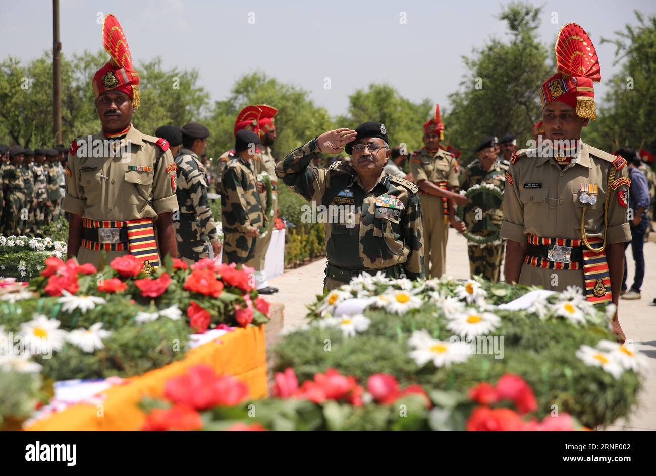 (160604) -- SRINAGAR, June 4, 2016 -- An official of India s Border Security Force (BSF) salutes to coffins of slain border guards during a wreath laying ceremony at a BSF camp in the outskirts of Srinagar, summer capital of Indian-controlled Kashmir, June 4, 2016. The militant attack on convoy of India s Border Security Force (BSF) on Friday left three border guards dead and nine others wounded, two of them critically, in restive Indian-controlled Kashmir, officials said. ) (cyc) INDIA-KASHMIR-SRINAGAR-MILITANT ATTACK JavedxDar PUBLICATIONxNOTxINxCHN   160604 Srinagar June 4 2016 to Official Stock Photo