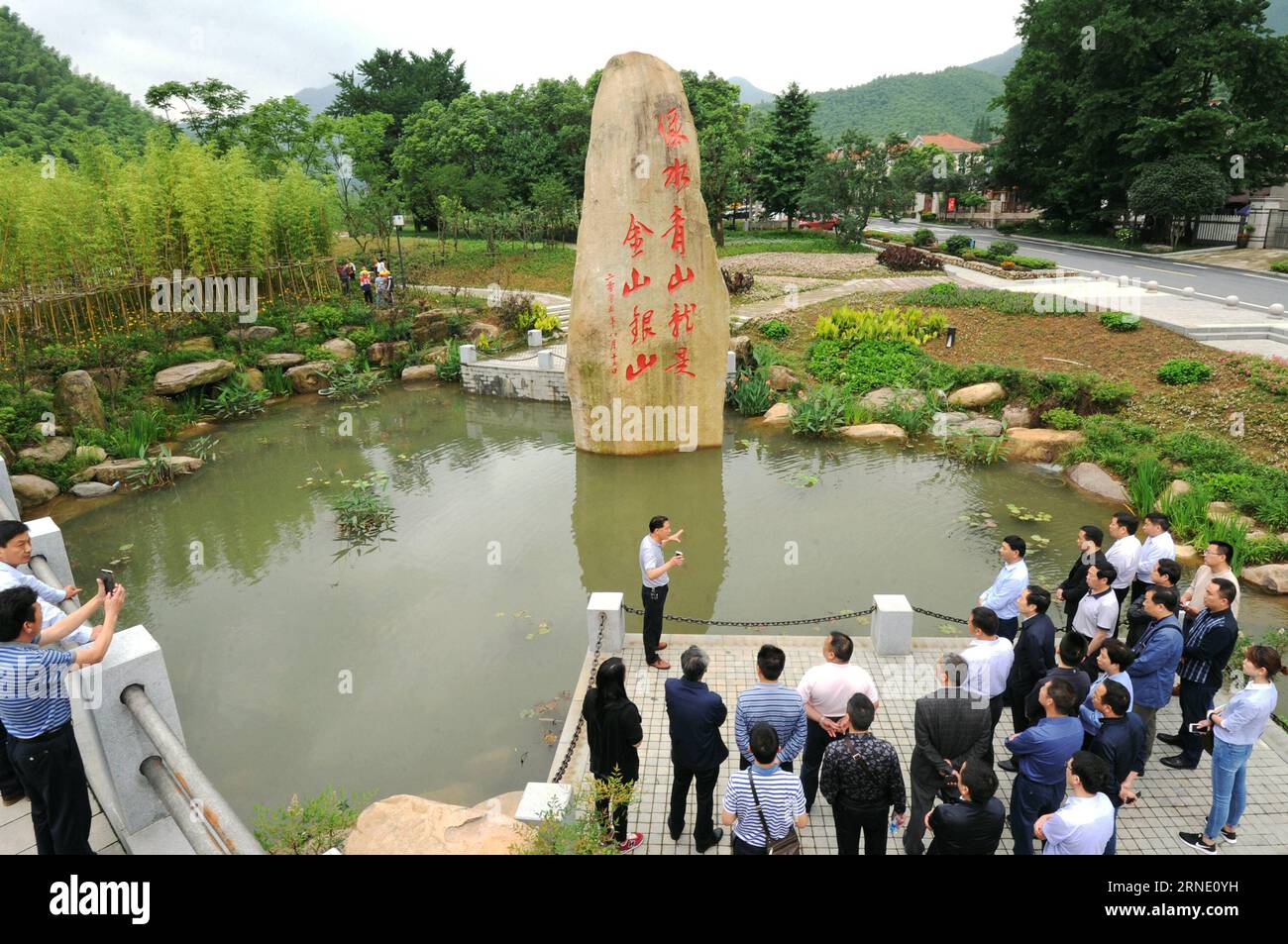 (160605) -- ANJI, June 5, 2016 -- Tourists visit the environment-friendly Yucun Village of Anji County, east China s Zhejiang Province, June 4, 2016. Anji is known for its pleasant environment with flourishing bamboo plantations and many scenes from the famous movie Crouching Tiger, Hidden Dragon were shot here. The county persists in green, low-carbon development, and strives to protect environment as well as to develop local economy. June 5 is observed as World Environment Day every year, and this year s theme issued by China s Ministry of Environment Protection is improving the quality of t Stock Photo