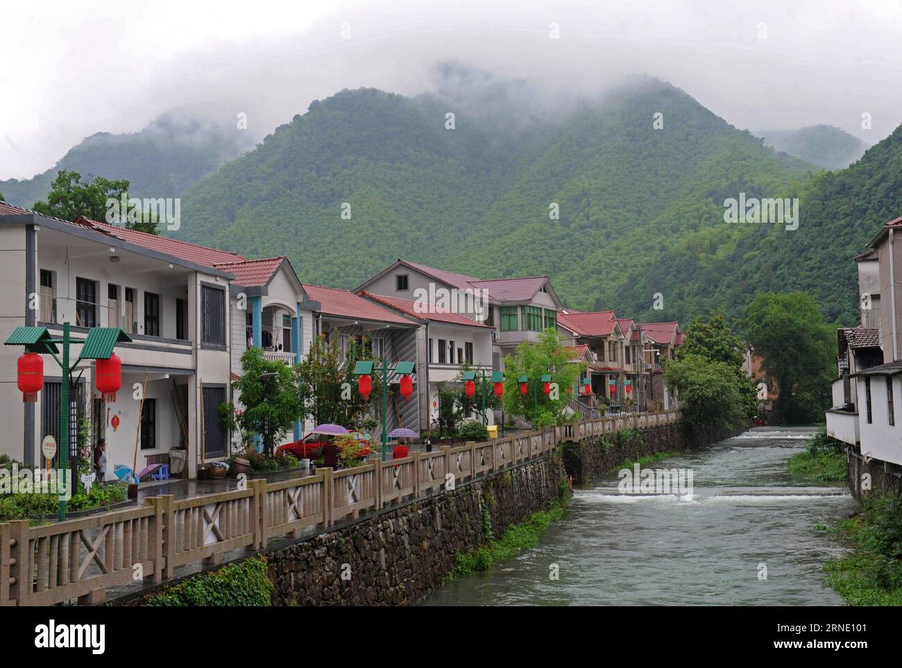 (160605) -- ANJI, June 5, 2016 -- Photo taken on June 3, 2016 shows the scenery of Shuangyi village, a national ecological model village, after rain in Anji County, east China s Zhejiang Province. Anji is known for its pleasant environment with flourishing bamboo plantations and many scenes from the famous movie Crouching Tiger, Hidden Dragon were shot here. The county persists in green, low-carbon development, and strives to protect environment as well as to develop local economy. June 5 is observed as World Environment Day every year, and this year s theme issued by China s Ministry of Envir Stock Photo