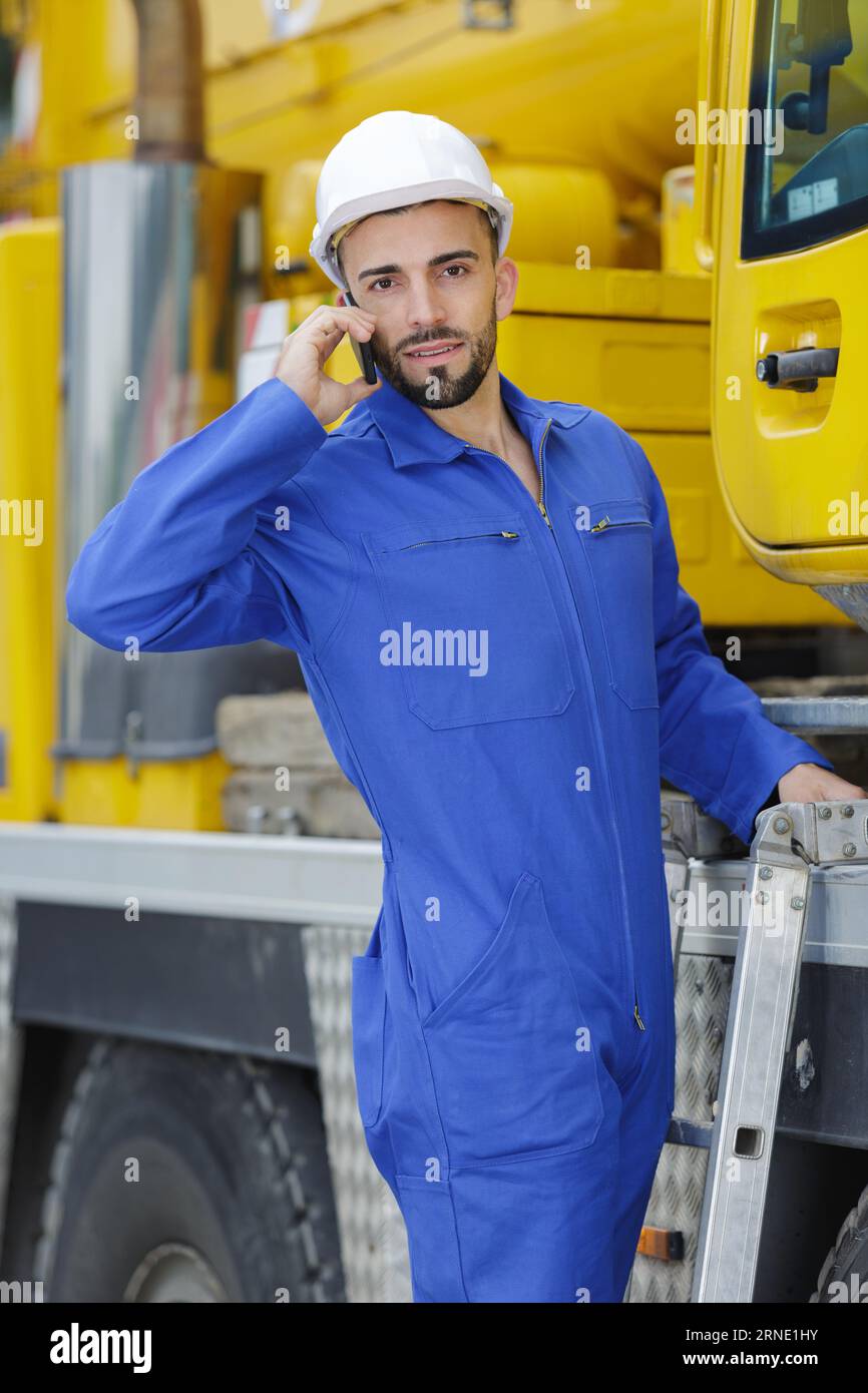 busy dockworker using the phone with cargo transportation Stock Photo