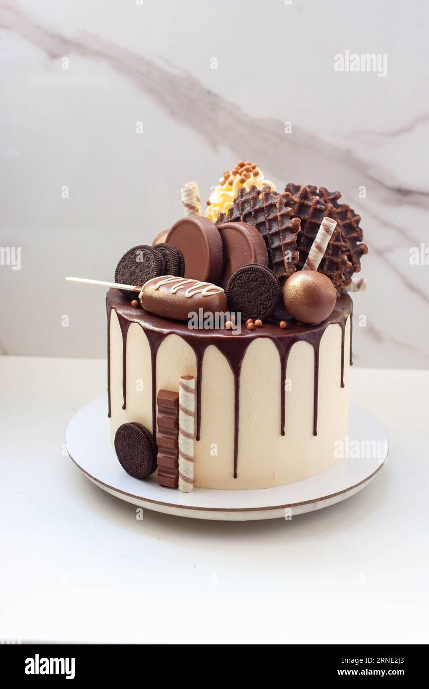 Chocolate birthday cake with chocolate ganache drip icing, popsicles