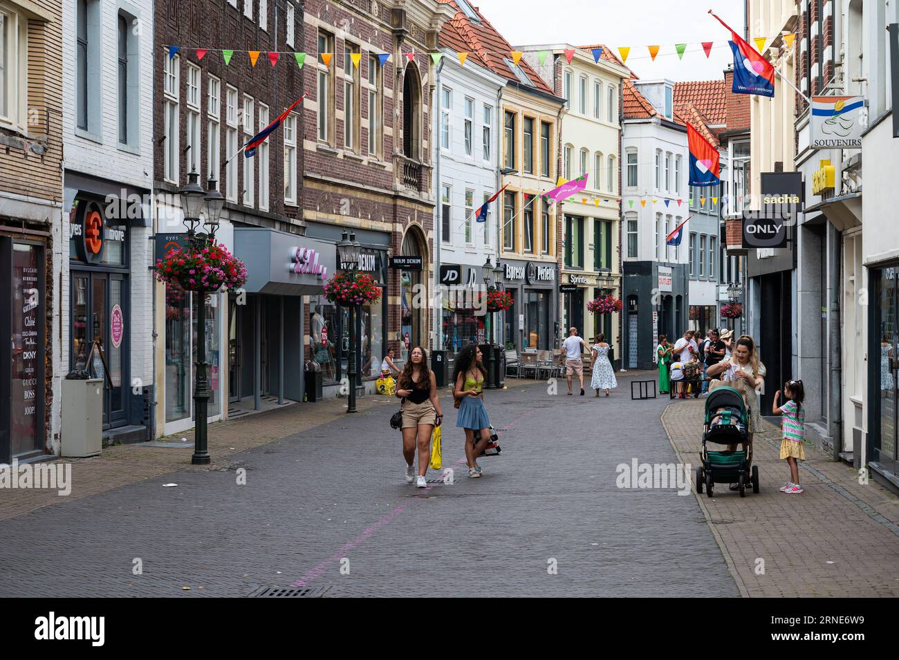 Venlo, Limburg, The Netherlands, July 12, 2023 - People walking through ...