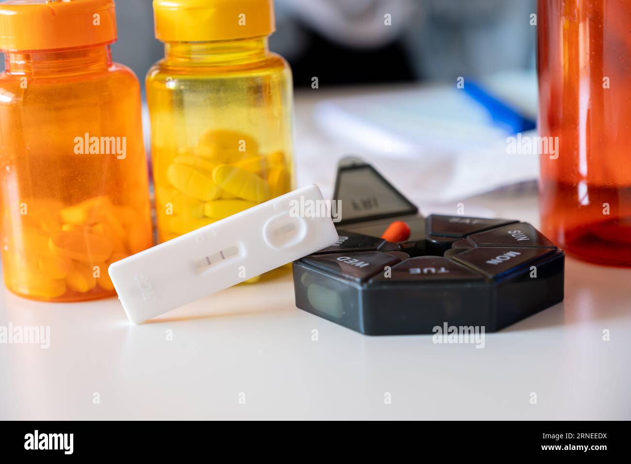 Concept of pregnancy test with supplements represents the costs of