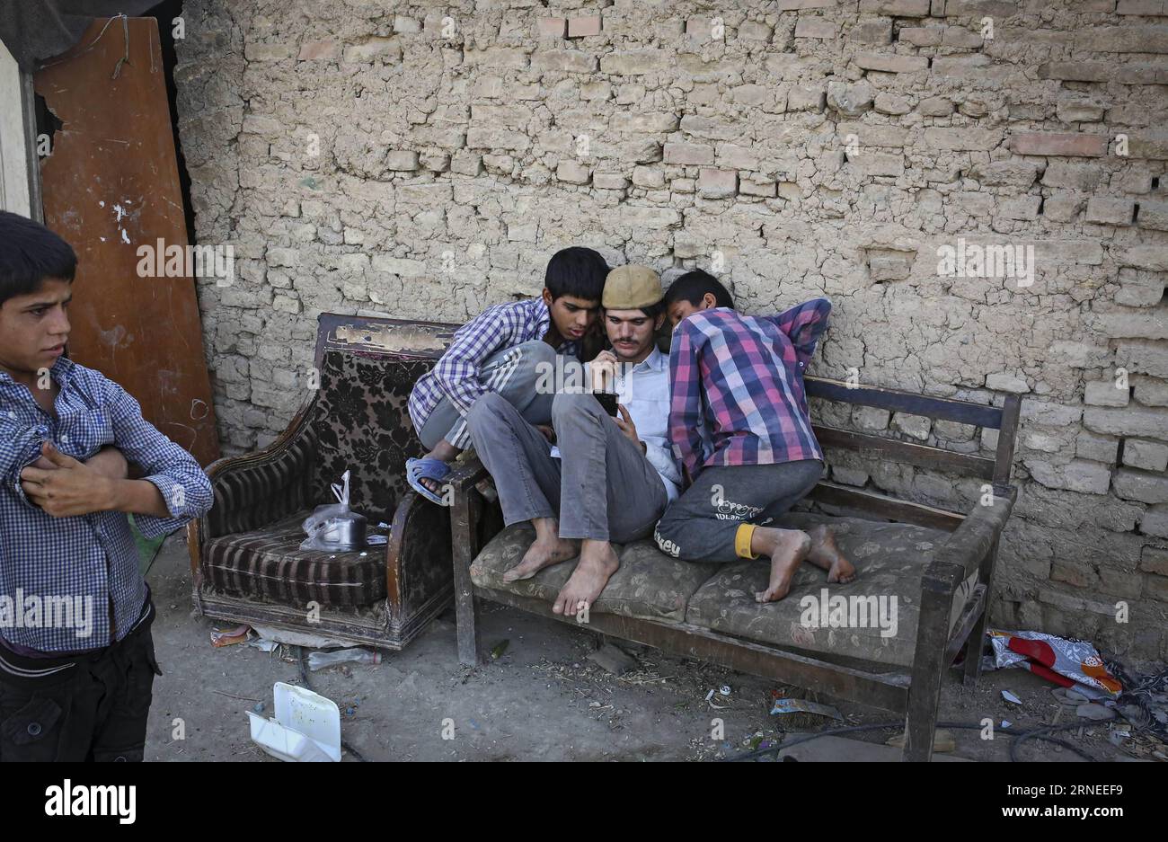 TEHRAN, June 20, 2016 -- Pakistani refugees kill time in a slum on the outskirts of Tehran, capital of Iran, on June 20, 2016, the world refugee day. ) IRAN-TEHRAN-PAKISTANI REFUGEES AhmadxHalabisaz PUBLICATIONxNOTxINxCHN   TEHRAN June 20 2016 Pakistani Refugees Kill Time in a Slum ON The outskirts of TEHRAN Capital of Iran ON June 20 2016 The World Refugee Day Iran TEHRAN Pakistani Refugees AhmadxHalabisaz PUBLICATIONxNOTxINxCHN Stock Photo