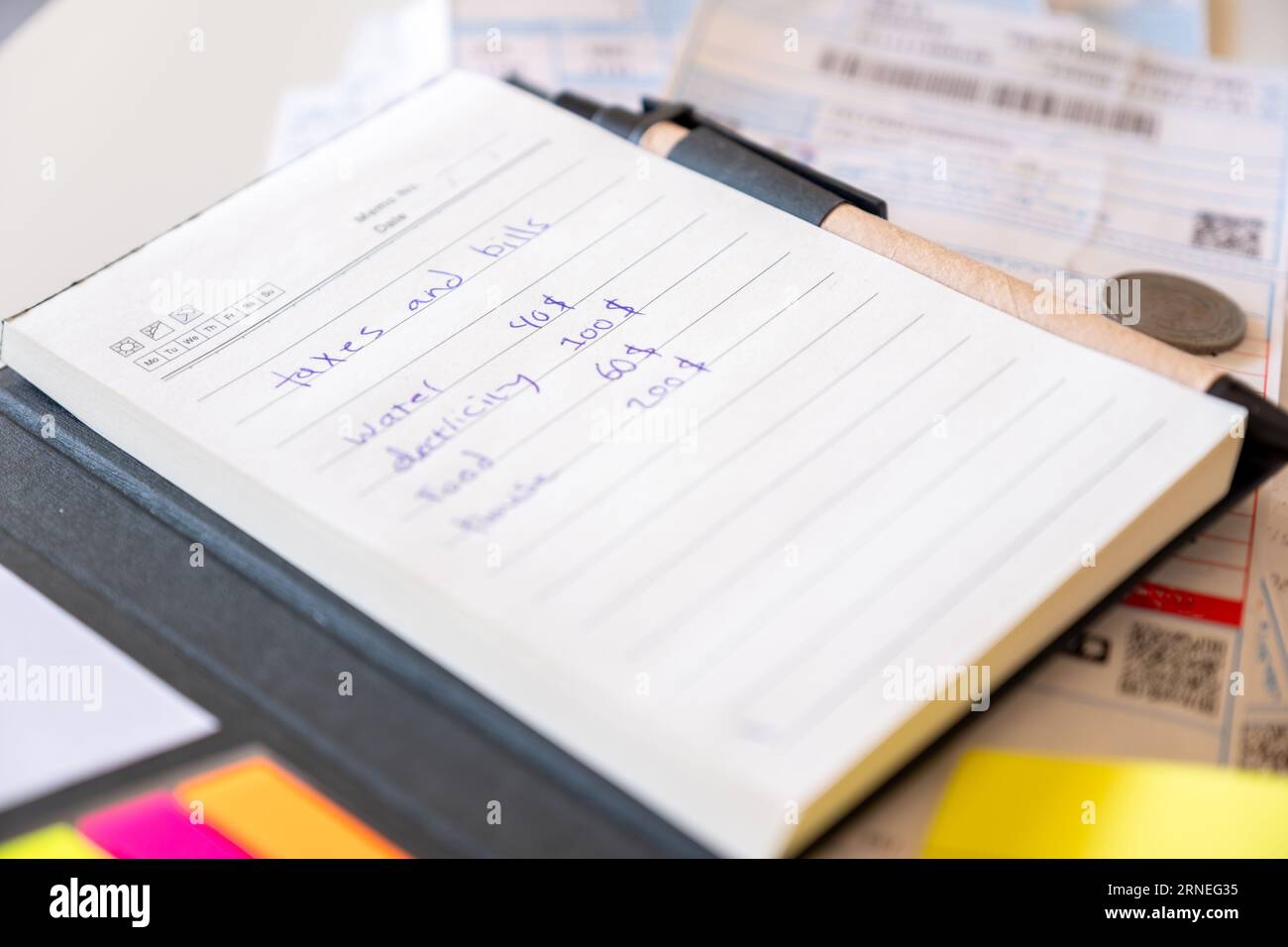 note book show the taxes food and bills costs per month Stock Photo Alamy