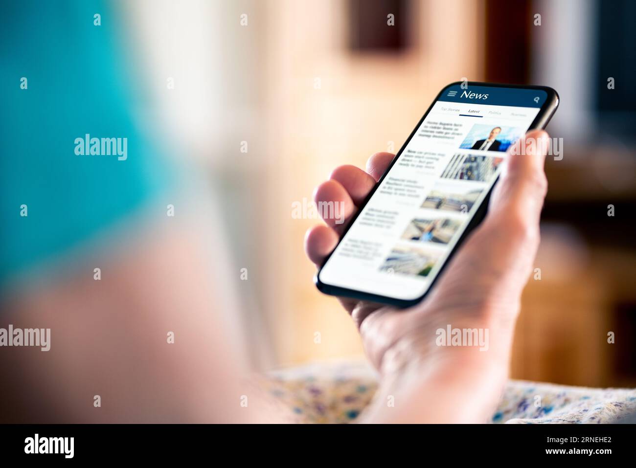 News online. Mobile phone screen. Senior woman reading newspaper on web portal and website. Latest daily information. Headlines on internet. Stock Photo