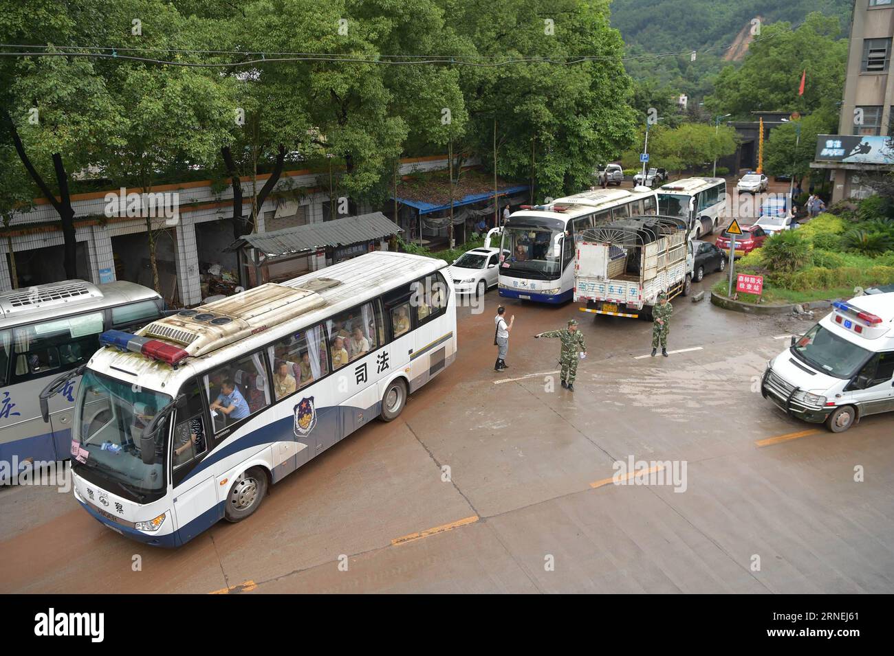 (160624) -- CHONGQING, June 24, 2016 -- Police vehicles carrying prisoners set off from Yuxi Prison in Yongchuan of Chongqing, southwest China, June 24, 2016. Heavy rain on Thursday night flooded a section of the outer wall of Yuxi Prison forcing the relocation of 1,400 inmates over night. The prison authority has reinforced security and ensured provisions. )(mcg/yxb) CHINA-CHONGQING-HEAVY RAIN-PRISONER-RELOCATION (CN) ChenxCheng PUBLICATIONxNOTxINxCHN   160624 Chongqing June 24 2016 Police VEHICLES carrying Prisoners Set off from Yuxi Prison in Chuan Yong of Chongqing Southwest China June 24 Stock Photo