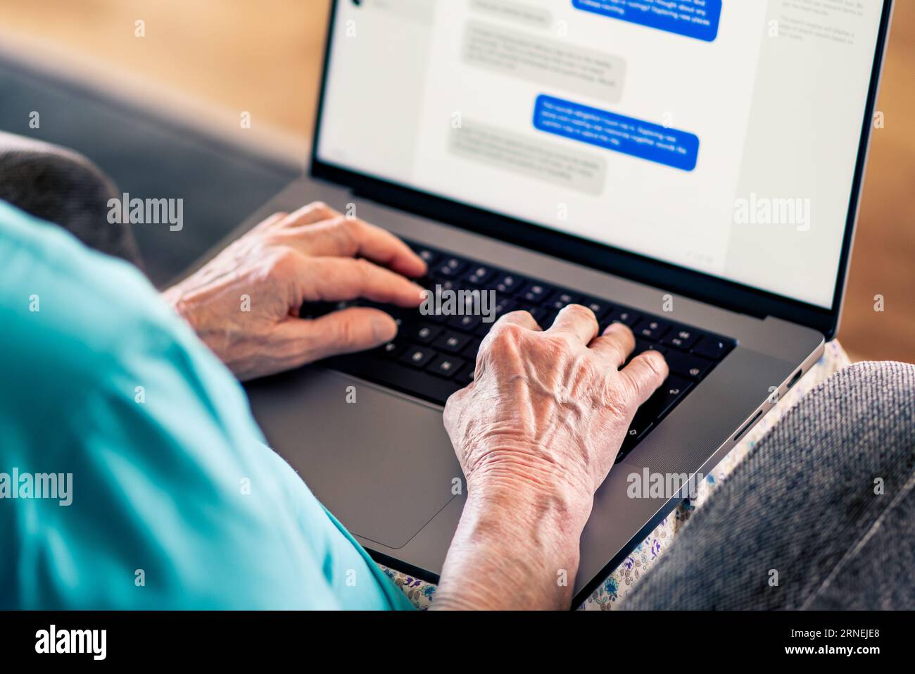 Old woman and online romance scam. Love and money fraud on internet. Elder senior using computer. Fake profile and catfish on dating website. Stock Photo