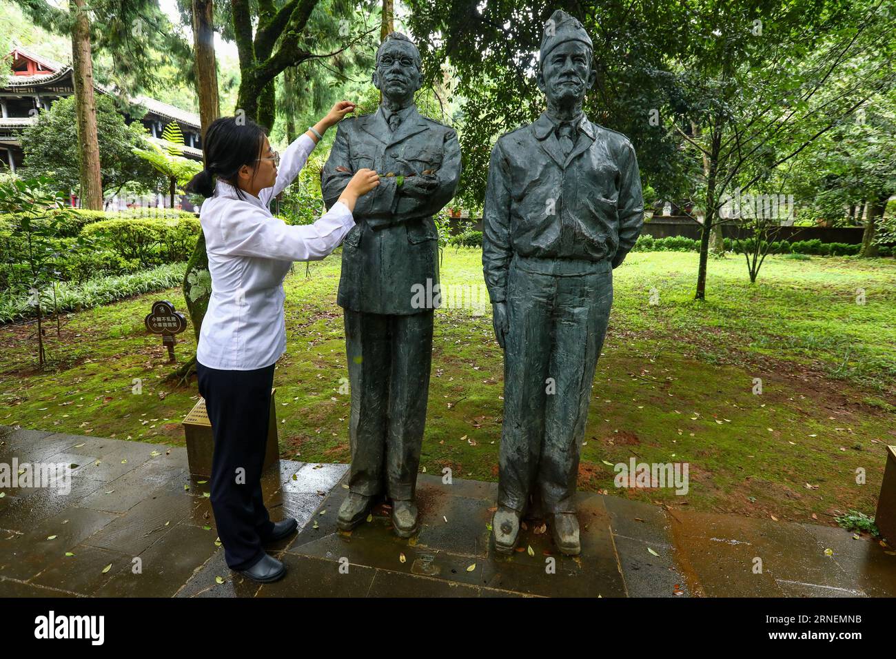 (230901) -- KUNMING, Sept. 1, 2023 (Xinhua) -- A worker removes fallen ...