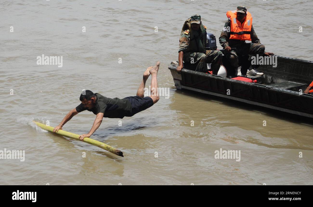 (160629) -- GUWAHATI, June 29, 2016 -- Participants practise rescue procedure over water during a drill for disaster preparedness held on the river Brahmaputra near Guwahati, capital of India s northeastern state of Assam, June 29, 2016. The drill is initiated by the state government and the Armed Forces before the coming flood season. ) (zjy) INDIA-GUWAHATI-DISASTER PREPAREDNESS-DRILL Stringer PUBLICATIONxNOTxINxCHN   160629 Guwahati June 29 2016 Participants practice Rescue procedure Over Water during a Drill for Disaster Preparedness Hero ON The River Brahmaputra Near Guwahati Capital of In Stock Photo