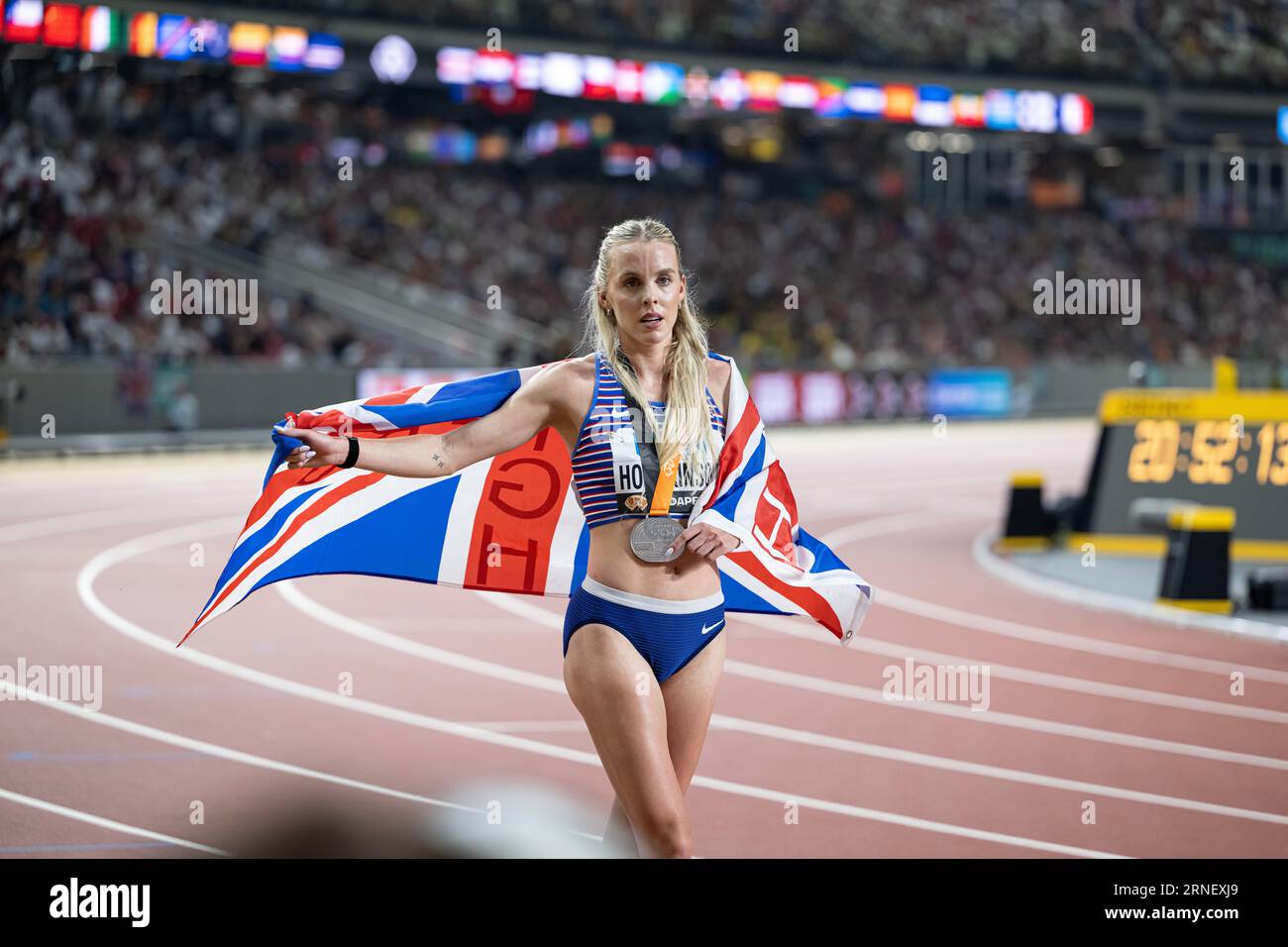 Keely Hodgkinson Celebrating Her Medal With Her Country s Flag In The Keely Hodgkinson Celebrating Her Medal With Her Country s Flag In The