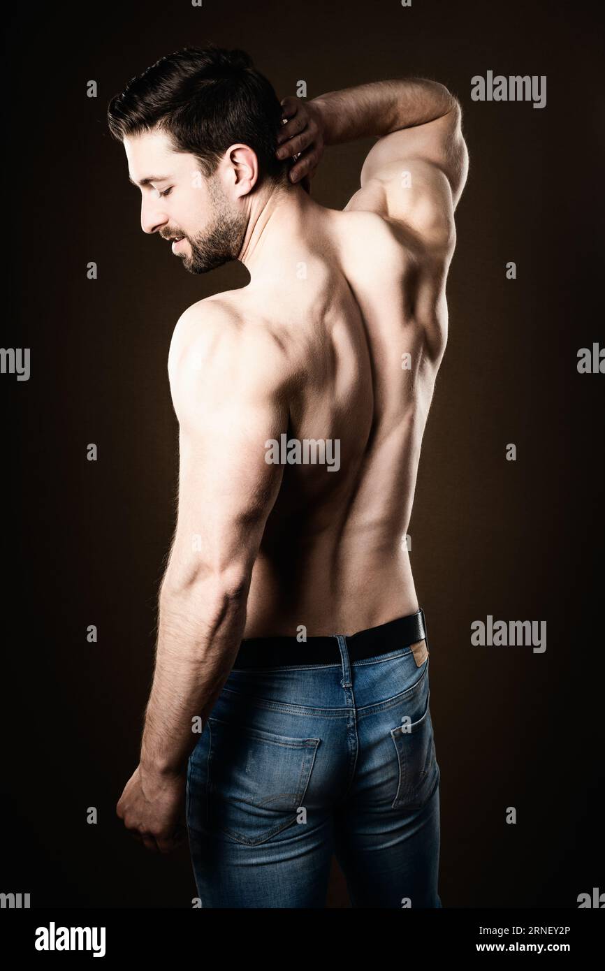 athlete show well trained back with twinges and soreness caused by training Stock Photo
