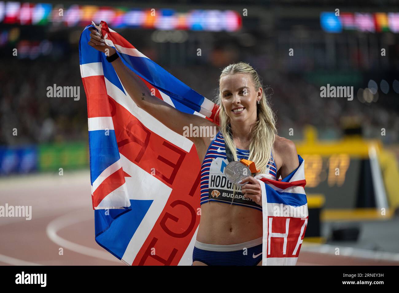 Keely Hodgkinson Celebrating Her Medal With Her Country s Flag In The Keely Hodgkinson Celebrating Her Medal With Her Country s Flag In The