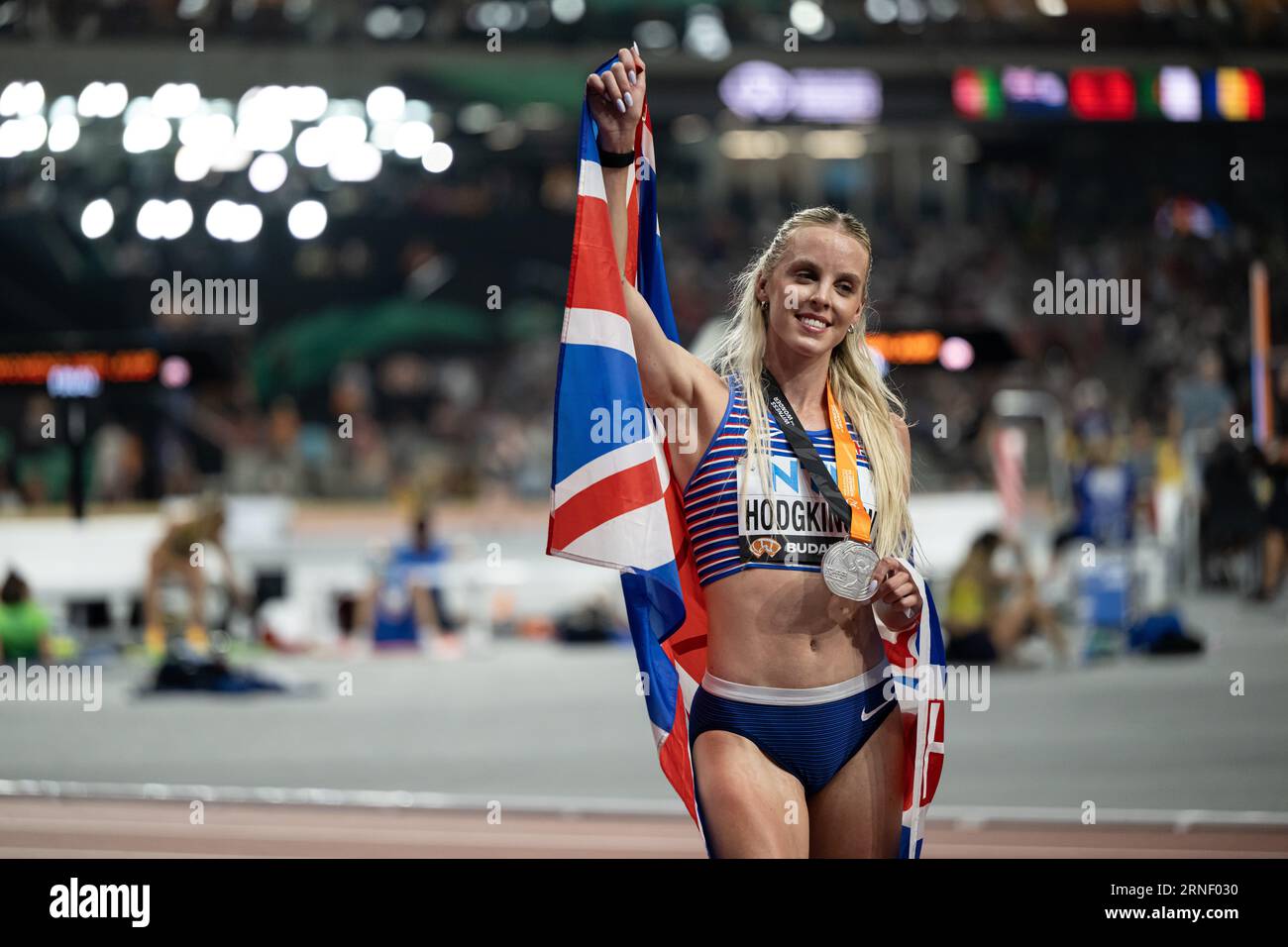 Keely Hodgkinson Celebrating Her Medal With Her Country s Flag In The Keely Hodgkinson Celebrating Her Medal With Her Country s Flag In The