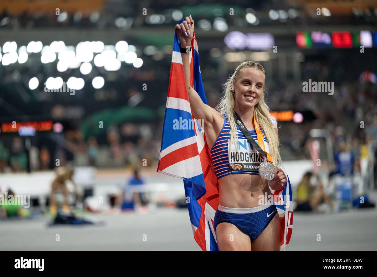 Keely Hodgkinson Celebrating Her Medal With Her Country s Flag In The Keely Hodgkinson Celebrating Her Medal With Her Country s Flag In The