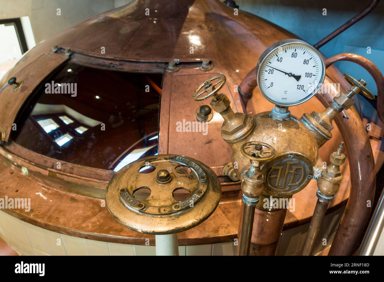 Gauge and valves on copper kettle of Trappist beer brewery in the Orval Abbey / Abbaye Notre-Dame d'Orval, Villers-devant-Orval, Wallonia, Belgium Stock Photo