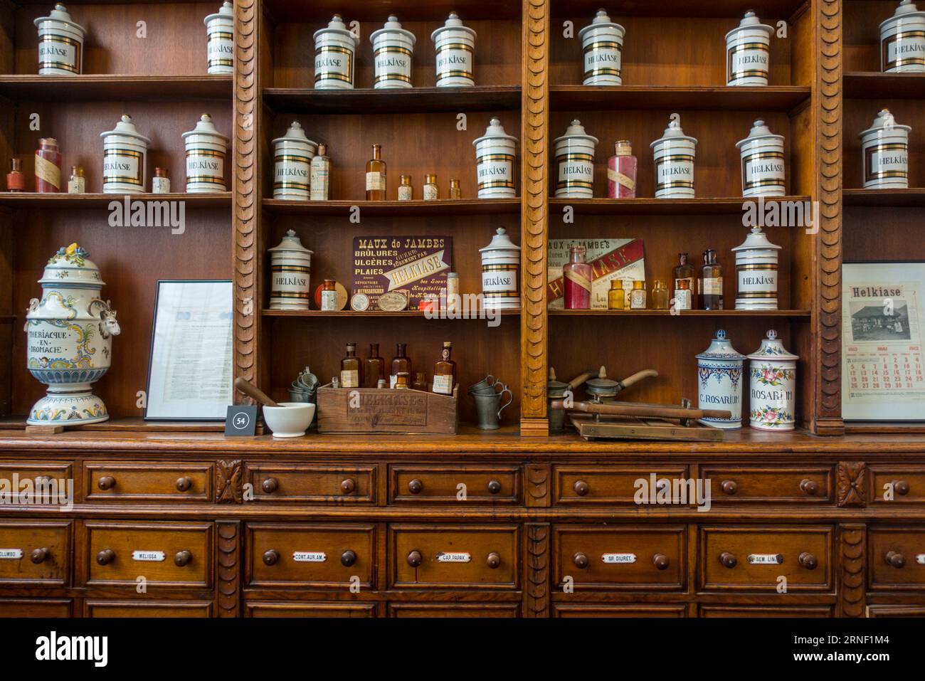 Antique pharmacy cabinet with vintage porcelain jars in the Hôpital Notre-Dame à la Rose / Hospital of Our Lady, Lessines / Lessen, Hainaut, Belgium Stock Photo