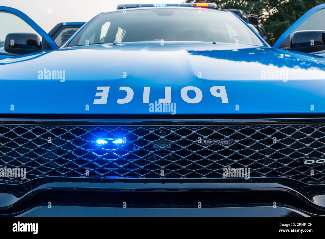 United States Police car with blue lights on Stock Photo