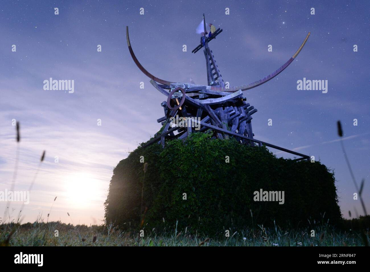 NIKOLA-LENIVETS, July 23, 2016 -- Art work Gilded Calf is displayed during a landscape architecture festival called Archstoyanie in Nikola-Lenivets, Russia, July 23, 2016. The annual event held in Nikola-Lenivets outside Moscow presents brand-new ideas that could redefine visitors view of architecture. )(zcc) RUSSIA-NIKOLA-LENIVETS-ARCHSTOYANIE FESTIVAL PavelxBednyakov PUBLICATIONxNOTxINxCHN   Nikola Lenivets July 23 2016 Art Work Gilded Calf IS displayed during a Landscape Architecture Festival called Archstoyanie in Nikola Lenivets Russia July 23 2016 The Annual Event Hero in Nikola Lenivets Stock Photo