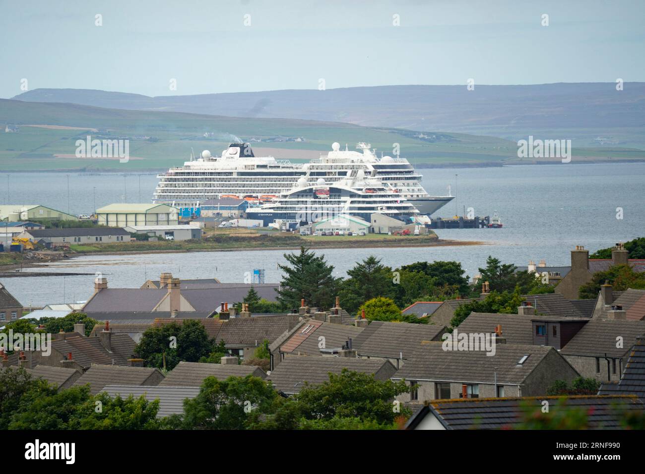 Stromness, Orkney,  Scotland, UK. 1st September 2023. American tourists from visiting cruise ships berthed at Kirkwall visit the Ring of Brodgar neolithic standing stone circle on Orkney. Concerns have been raised by locals that cruise ships are bringing too many tourists to the Islands and current infrastructure cannot cope. Pic; Cruise ships moored at Kirkwall port. Iain Masterton/Alamy Live News Stock Photo