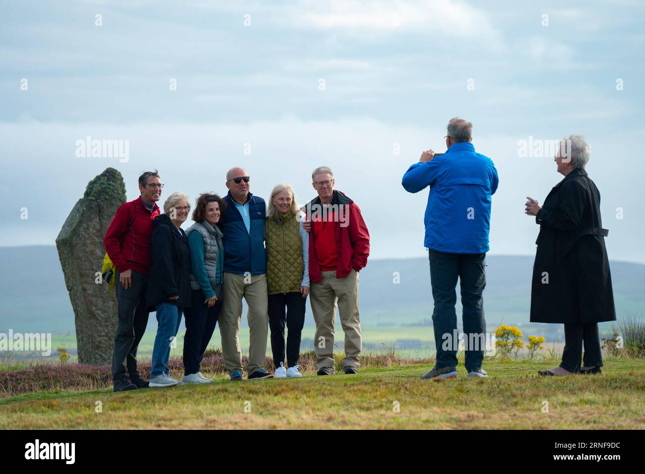 Stromness, Orkney,  Scotland, UK. 1st September 2023. American tourists from visiting cruise ships berthed at Kirkwall visit the Ring of Brodgar neolithic standing stone circle on Orkney. Concerns have been raised by locals that cruise ships are bringing too many tourists to the Islands and current infrastructure cannot cope. Iain Masterton/Alamy Live News Stock Photo