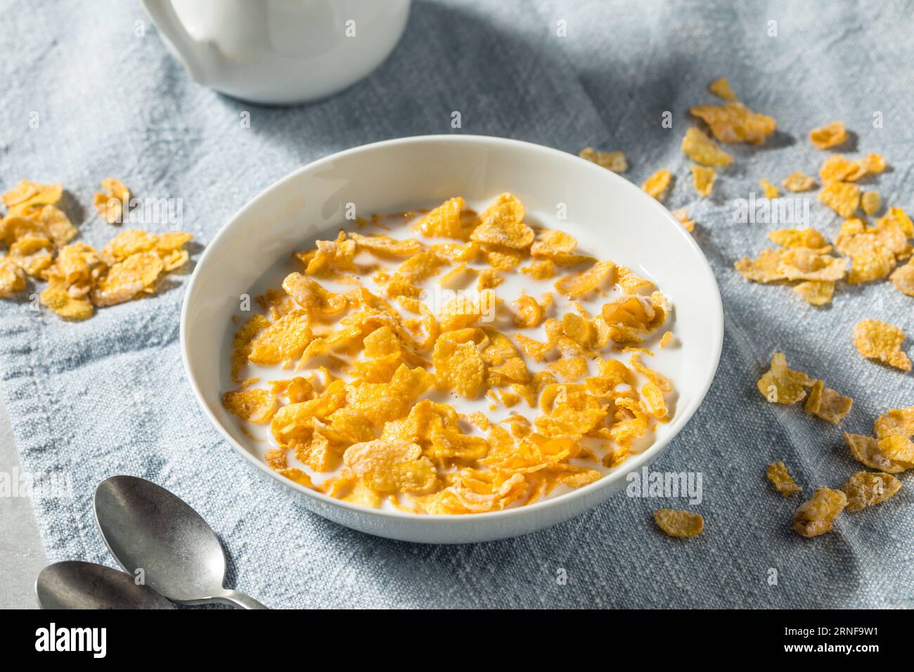 Sweet Organic Frosted Corn Flakes Cereal with Whole Milk Stock Photo
