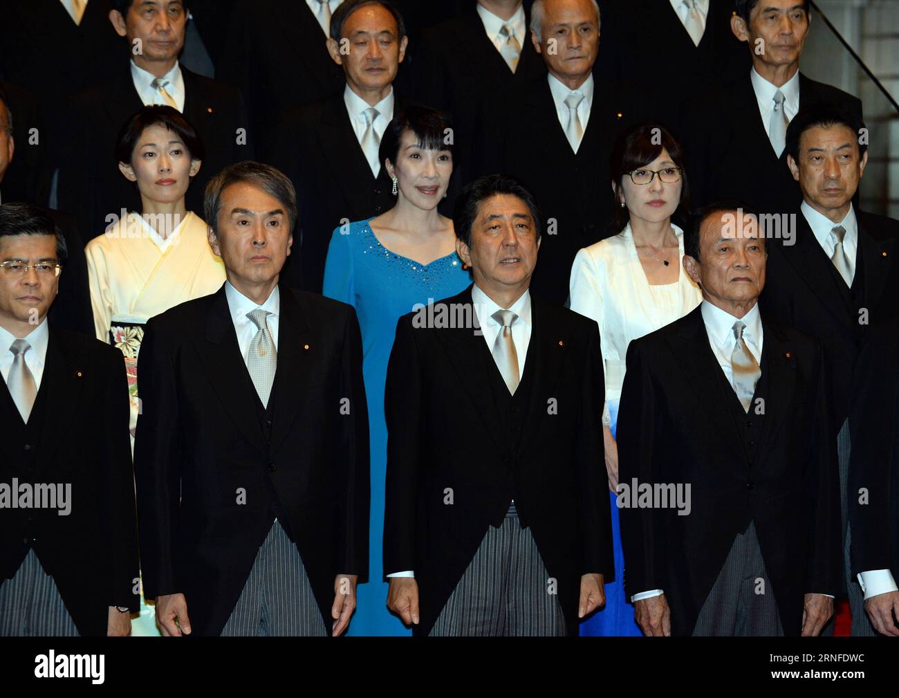 (160803) -- TOKYO, Aug. 3, 2016 -- Japanese Prime Minister Shinzo Abe (2nd R, Front) and cabinet ministers pose during a photo session at Abe s official residence in Tokyo, capital of Japan, on Aug. 3, 2016. Japanese Prime Minister Shinzo Abe, in a cabinet reshuffle on Wednesday, retained almost half of his ministers in their current positions although controversially appointed Tomomi Inada, the former head of the ruling Liberal Democratic Party s Policy Research Council, to take on the defense minister portfolio replacing Gen Nakatani. ) (lr) JAPAN-TOKYO-CABINET-RESHUFFLE MaxPing PUBLICATIONx Stock Photo