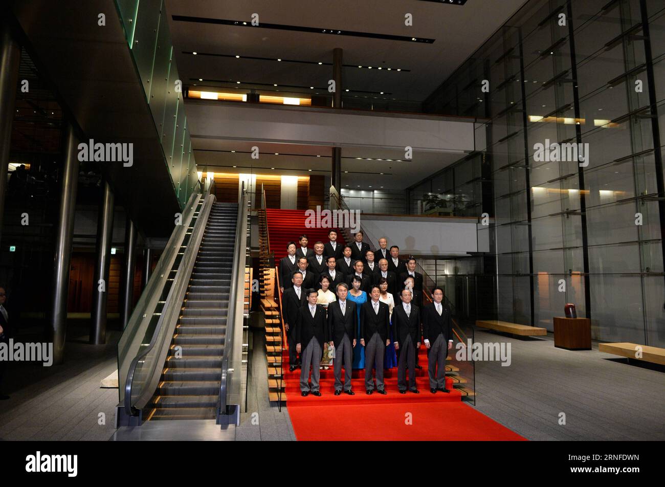 (160803) -- TOKYO, Aug. 3, 2016 -- Japanese Prime Minister Shinzo Abe (C, Front) and cabinet ministers pose during a photo session at Abe s official residence in Tokyo, capital of Japan, on Aug. 3, 2016. Japanese Prime Minister Shinzo Abe, in a cabinet reshuffle on Wednesday, retained almost half of his ministers in their current positions although controversially appointed Tomomi Inada, the former head of the ruling Liberal Democratic Party s Policy Research Council, to take on the defense minister portfolio replacing Gen Nakatani. ) (lr) JAPAN-TOKYO-CABINET-RESHUFFLE MaxPing PUBLICATIONxNOTx Stock Photo