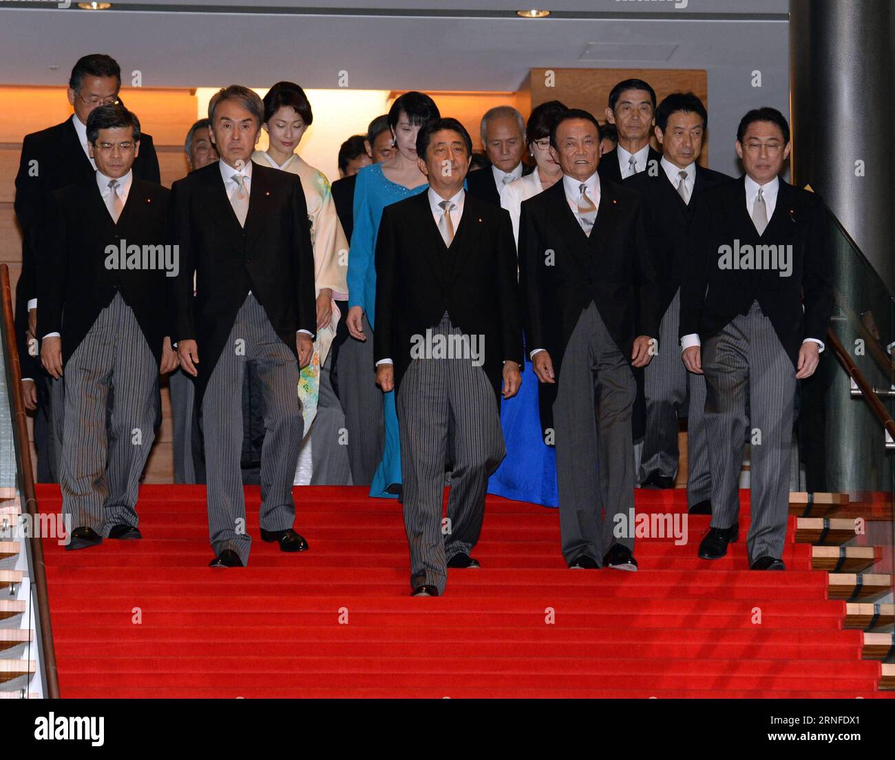 (160803) -- TOKYO, Aug. 3, 2016 -- Japanese Prime Minister Shinzo Abe (C, Front) and cabinet ministers prepare to pose for a photo session at Abe s official residence in Tokyo, capital of Japan, on Aug. 3, 2016. Japanese Prime Minister Shinzo Abe, in a cabinet reshuffle on Wednesday, retained almost half of his ministers in their current positions although controversially appointed Tomomi Inada, the former head of the ruling Liberal Democratic Party s Policy Research Council, to take on the defense minister portfolio replacing Gen Nakatani. ) (lr) JAPAN-TOKYO-CABINET-RESHUFFLE MaxPing PUBLICAT Stock Photo