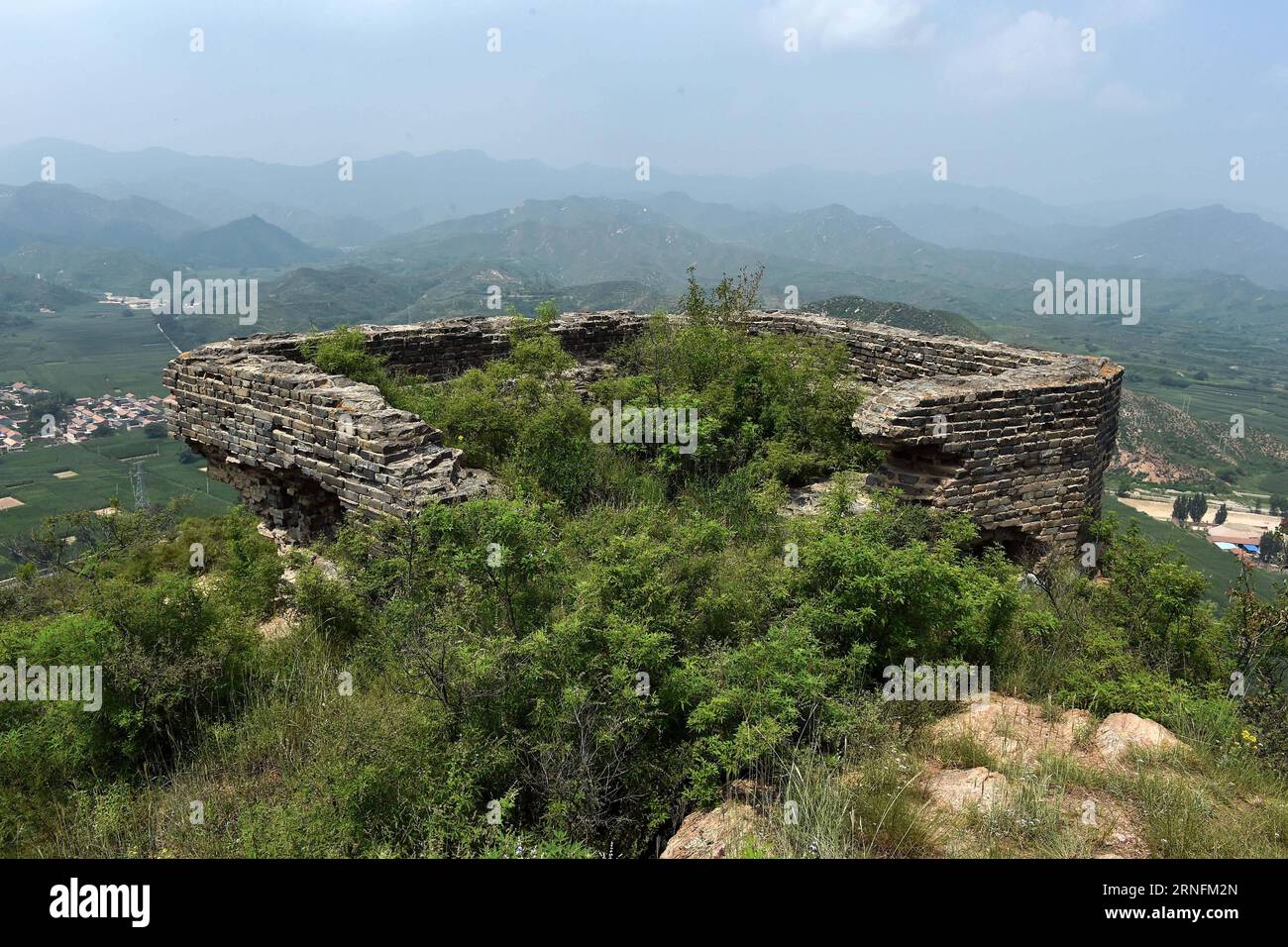 (160815) -- TAIYUAN, Aug. 15, 2016 -- Photo taken on Aug. 11, 2016 shows ruins of a blockhouse of the Japanese army on Fengpo Mountain in Shangshe Village of Yu County, north China s Shanxi Province. Monday marked the 71st anniversary of Japan s unconditional surrender at the end of World War II. Some 400,000 women in Asian were made into comfort women for the Japanese army during WWII, nearly half of which are Chinese, according to a research center of comfort women under the Humanities and Communication College of Shanghai Normal University. Since 1990, some 100 surviving comfort women began Stock Photo