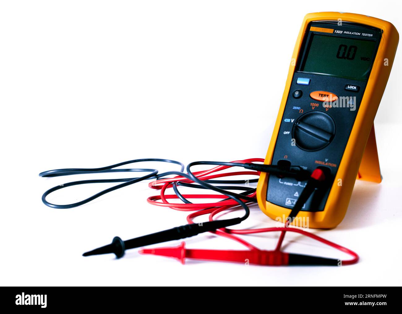 Digital multimeter with probes and green backlit display isolated on a white background Stock Photo