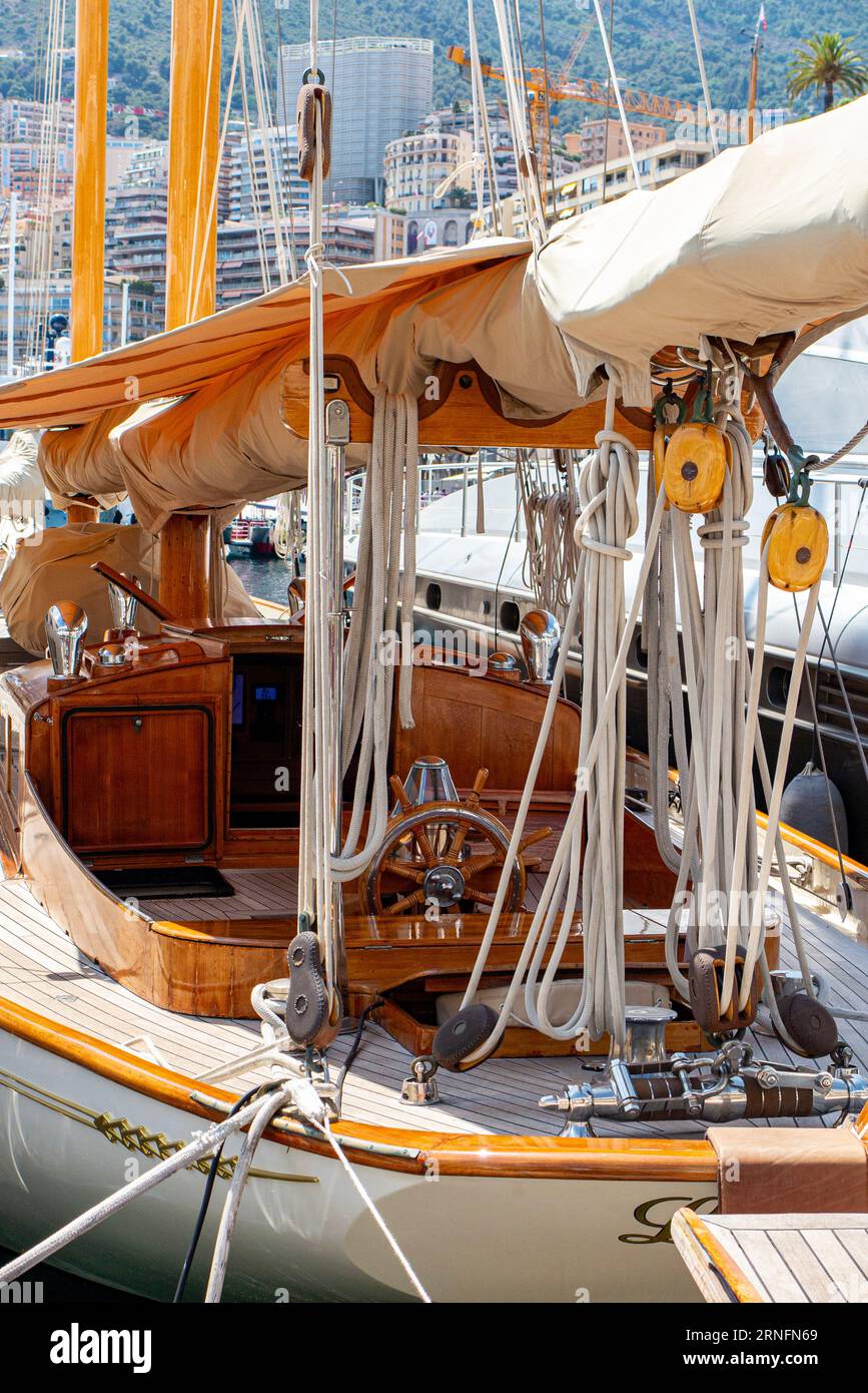 A beautiful sailing boat with classic styling and teak finish moored in