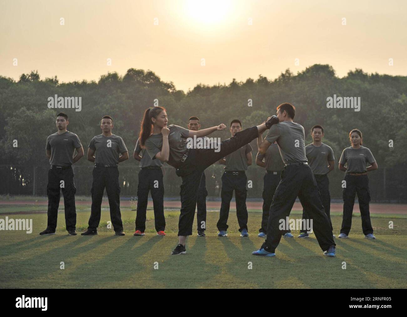 (160821) -- DEYANG, Aug. 20, 2016 -- Trainees practise catching and grappling at the Guanghan Campus of China Aviation Flight University of China in Deyang, southwest China s Sichuan Province, Aug. 20, 2016. Aviation security officer, also known as flight security officer, is responsible for guarding safety of persons on board and plane on a civil aircraft. To become an aviation security officer is not an easy thing. After a preliminary training for two months and a half, applicants must have at least 100-hour training on real planes. Despite of rigid test, many Chinese young people choose thi Stock Photo