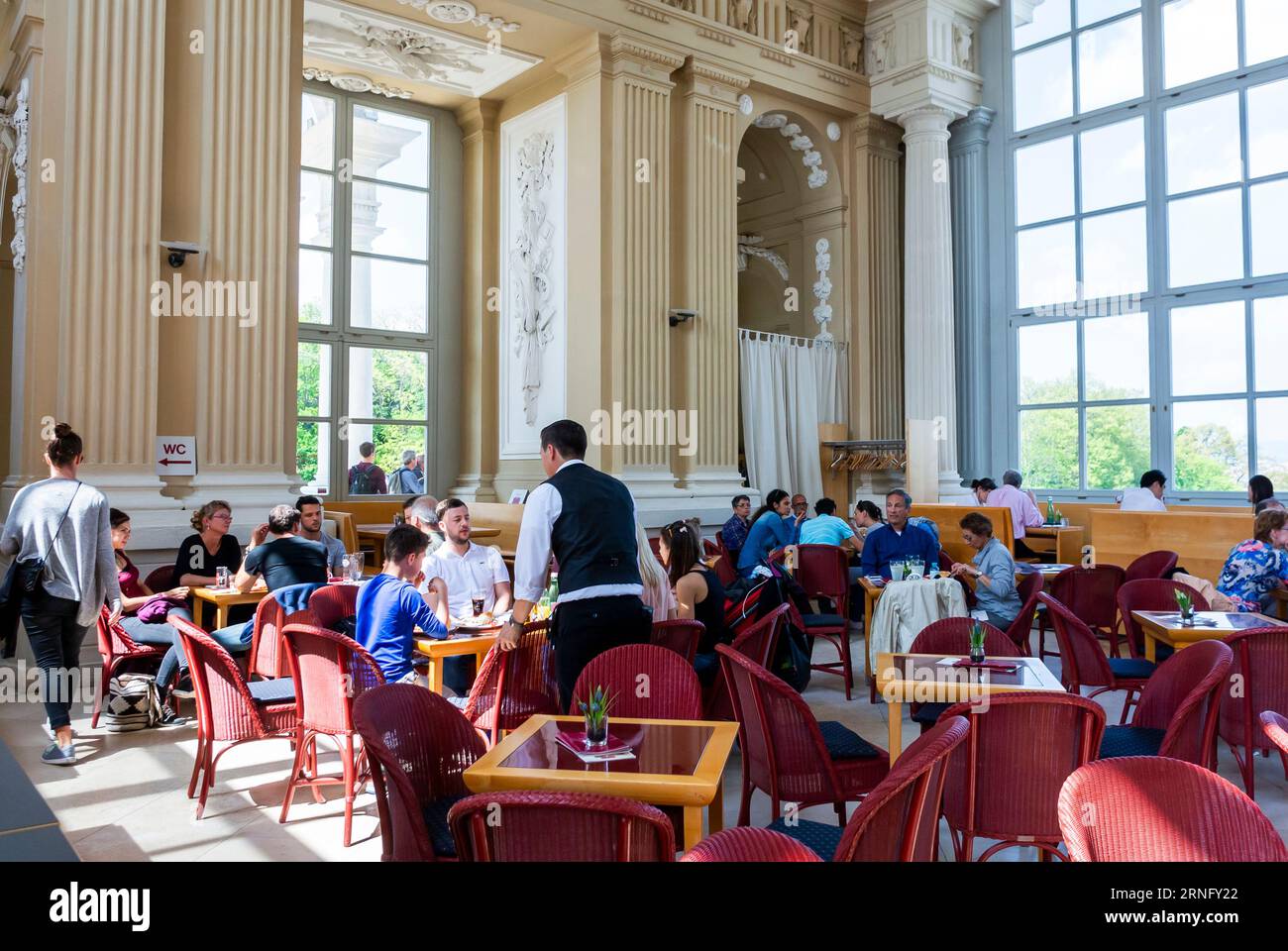 Vienna, Austria, Wide Angle View, waiter working, Large Crowd People inside Traditional Viennese Bistro Cafe Bar restaurant workers Stock Photo