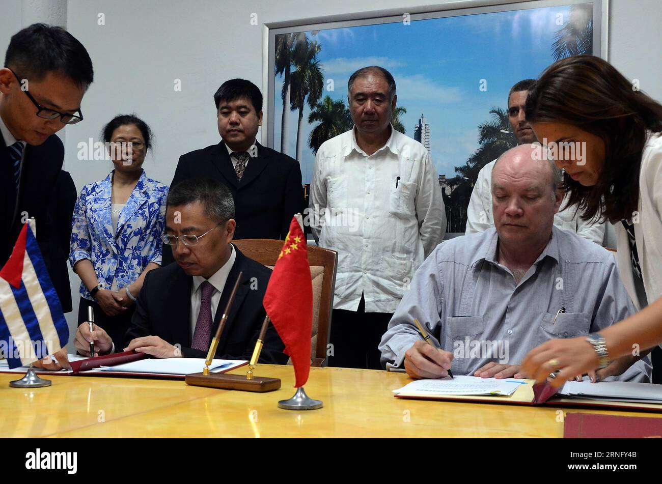 Zhang Xiangchen (2nd L F), deputy international trade representative with China s Ministry of Commerce, and Rodrigo Malmierca (2nd R), Cuba s Minister of Foreign Trade and Investment, sign the conclusive documents for joint projects in the sectors of telecommunications, industry and water resources in Havana, Cuba, on Aug. 26, 2016. Cuba and China on Friday signed new agreements aimed at deepening bilateral cooperation in a number of fields. Joaquin Hernandez) (djj) CUBA-HAVANA-CHINA-ECONOMIC COOPERATION Joaqu¨ªnxHern¨¢ndez PUBLICATIONxNOTxINxCHN   Zhang Xiangchen 2nd l F Deputy International Stock Photo