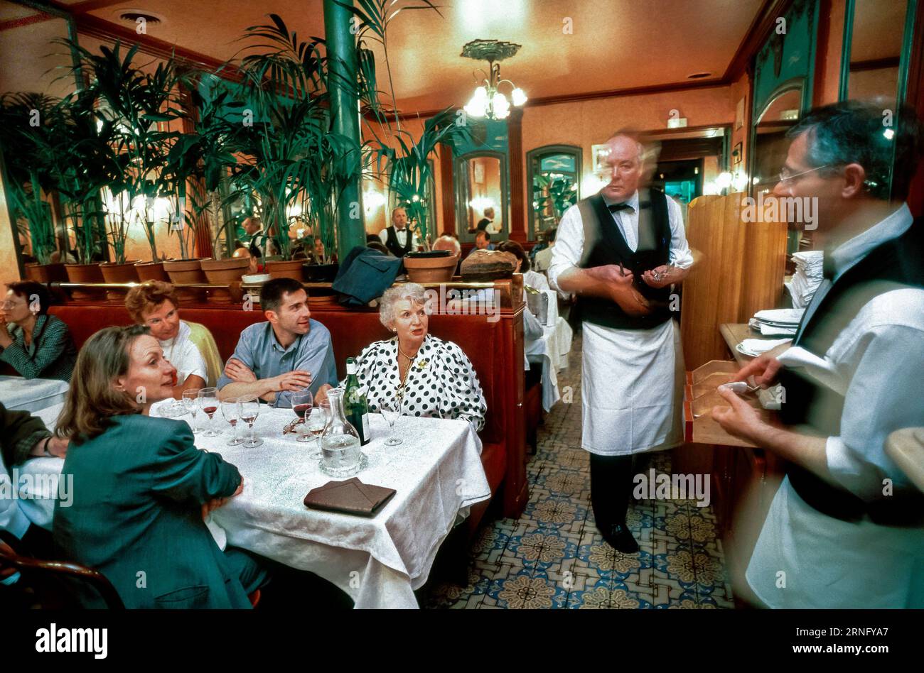 Paris, France Small Group People at Table inside Classic French Bistro Restaurant, with Waiters,'Au Petit Marguery', (9, Bd. port Royale, 75013) restaurant workers Stock Photo