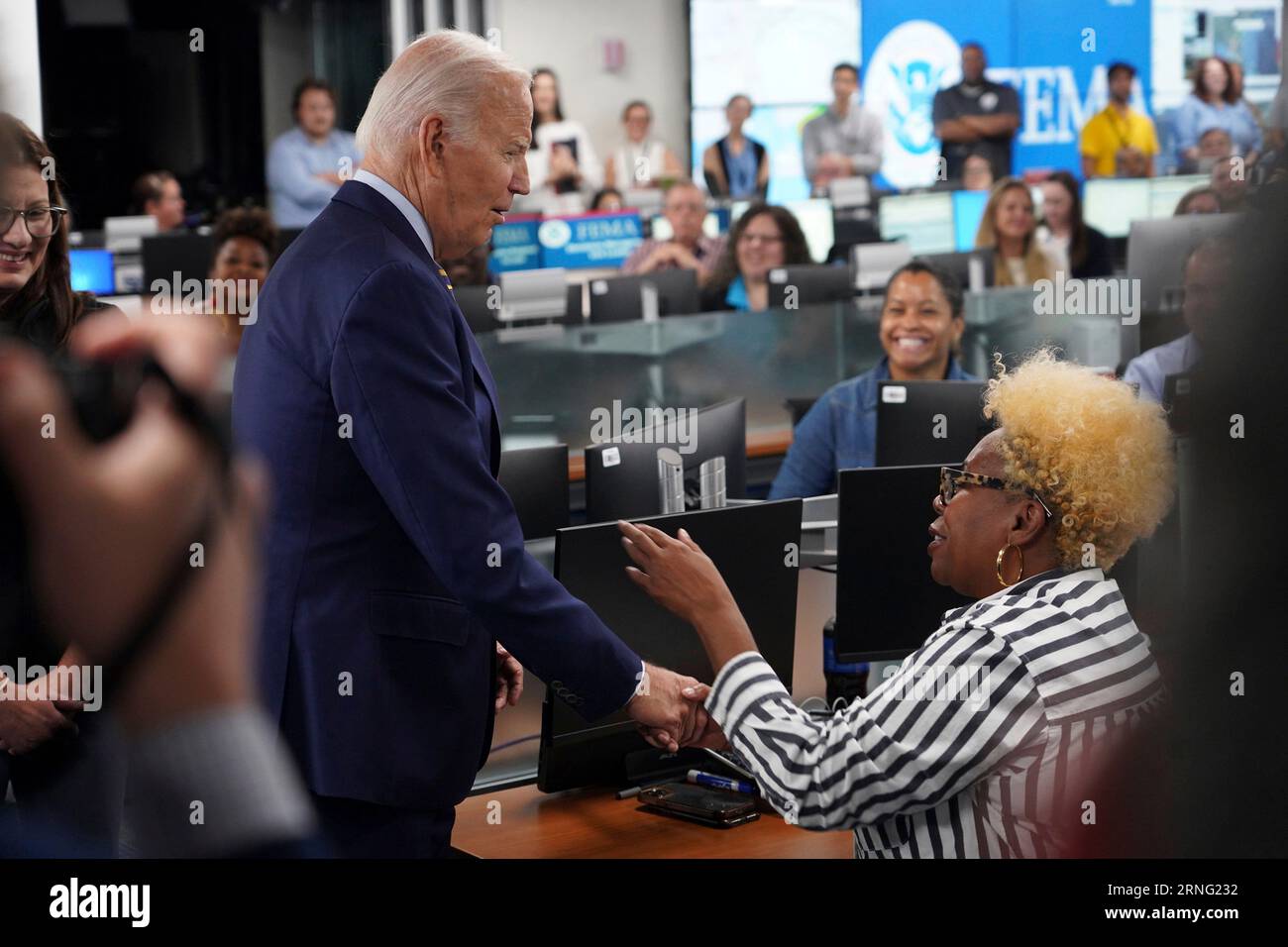 Washington, United States. 31st Aug, 2023. U.S. President Joe Biden, left, thanks emergency response staff during a visit following Hurricane Idalia at FEMA Headquarters, August 31, 2023 in Washington, DC Credit: Graham Haynes/FEMA/Alamy Live News Stock Photo