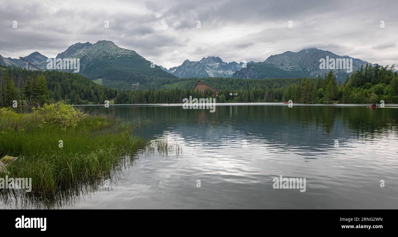 Scenic panorama of the shore of Lake Štrbské Pleso, Tatra Mountains, Slovakia. Stock Photo