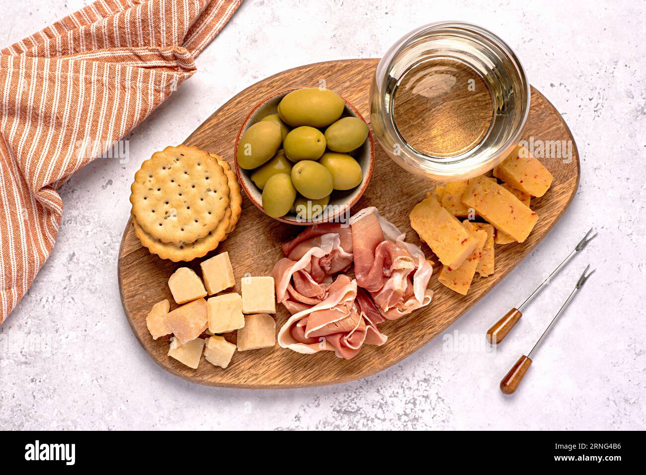 Food photography of antipasto, white wine, cheese, ham, serrano, olive ...