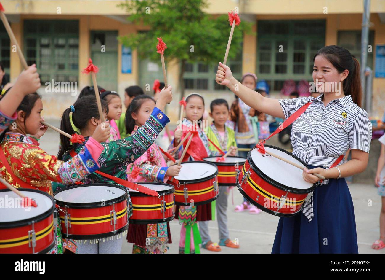Children playing drums in school hi-res stock photography and images ...