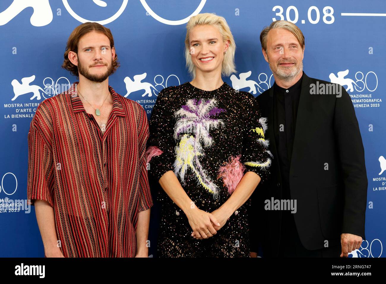 Simon Bennebjerg, Amanda Collin and Mads Mikkelsen pose at the