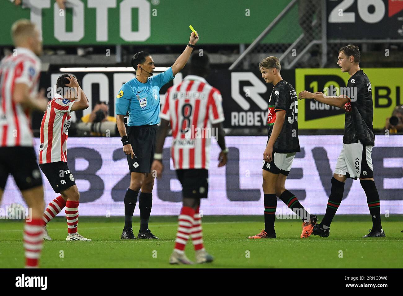 ROTTERDAM - Luc Netten of NEC (2r) is shown a yellow card by referee ...