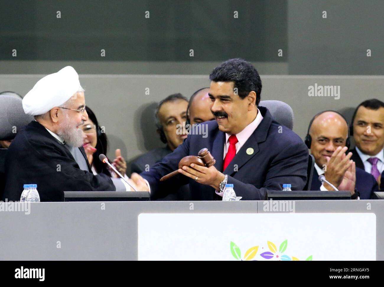 (160918) -- MARGARITA (VENEZUELA), Sept. 17, 2016 -- Venezuela s President Nicolas Maduro (R, front) shakes hands with Iranian President Hassan Rouhani at Hugo Chavez Frias Convention Center in Margarita Island, Venezuela, on Sept. 17, 2016. Iran officially handed over the three-year rotating presidency of the Non-Aligned Movement (NAM) to Venezuela at the 17th NAM Summit held Saturday in Venezuela s Margarita Island. Presidential Press/AVN) (jp) (fnc)(yy) VENEZUELA-MARGARITA-NAM-SUMMIT e AVN PUBLICATIONxNOTxINxCHN   Margarita Venezuela Sept 17 2016 Venezuela S President Nicolas Maduro r Front Stock Photo