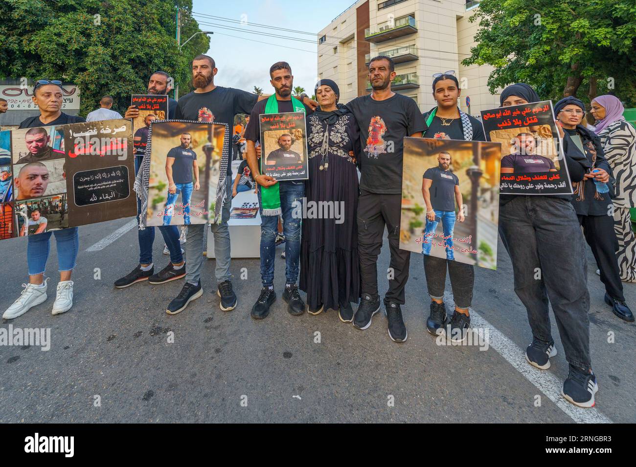 Haifa, Israel - August 31, 2023: People with pictures of their loved ones, part of the march of the dead protest against rising violence and murder ra Stock Photo