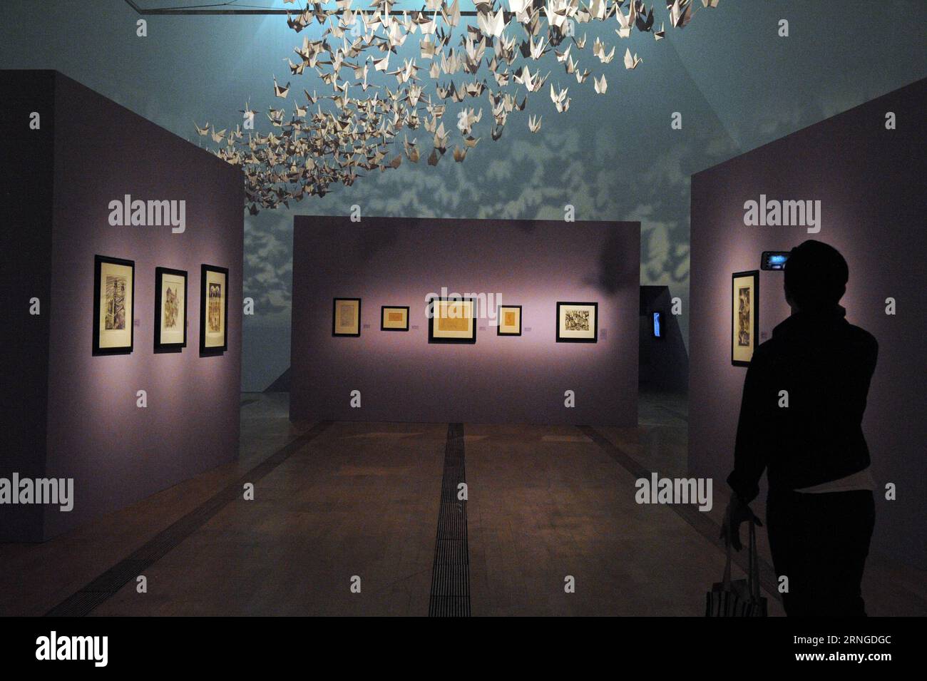 (160922) -- SINGAPORE, Sept. 22, 2016 -- A reporter takes photos of the works of M.C. Escher during a media preview at Singapore s Marina Bay Sands ArtScience Museum, Sept. 22, 2016. The exhibition of M.C. Escher s works will last from Sept. 24 to the first quarter of 2017. ) (sxk) SINGAPORE-ESCHER-EXHIBITION-MEDIA PREVIEW ThenxChihxWey PUBLICATIONxNOTxINxCHN   Singapore Sept 22 2016 a Reporter Takes Photos of The Works of M C Escher during a Media Preview AT Singapore S Marina Bay Sands ArtScience Museum Sept 22 2016 The Exhibition of M C Escher S Works will Load from Sept 24 to The First Qua Stock Photo