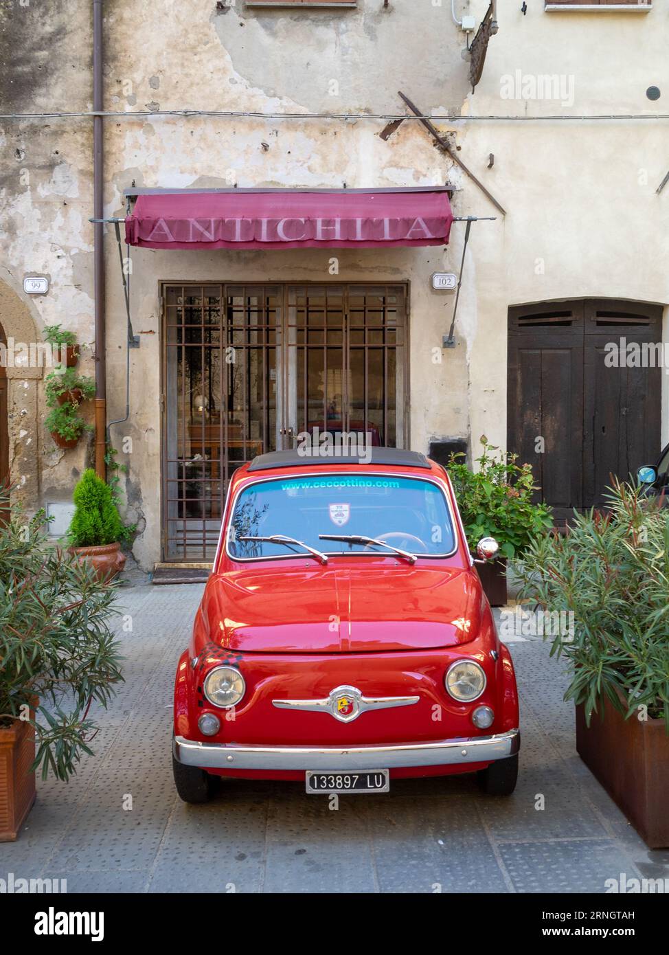 Red old Fiat 500 car in Pitigliano street Stock Photo - Alamy